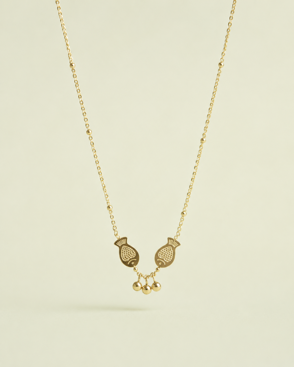 golden fish charm necklace